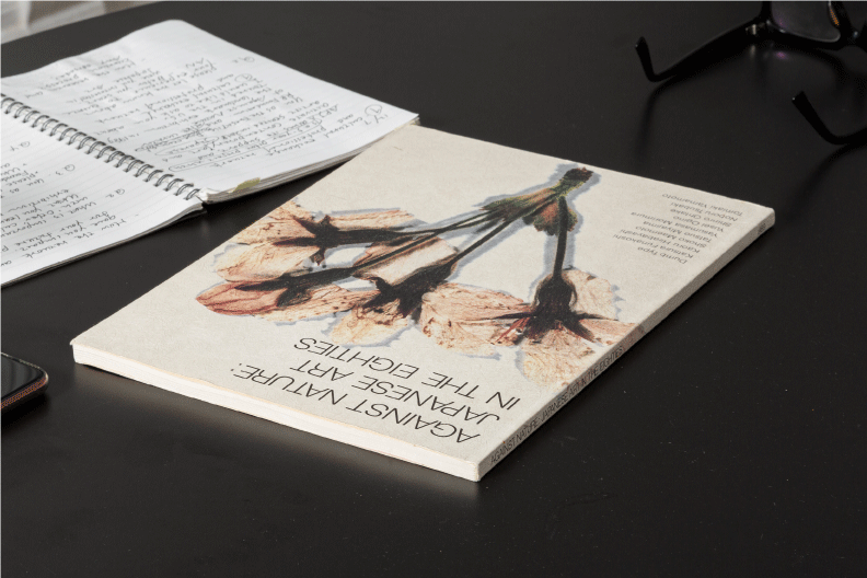 Photo of catalog and ring notebook on desk